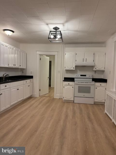 1424 Huddell Avenue Marcus Hook, PA 19061 - Photo 2 of 20 a kitchen with granite countertop a sink cabinets and stainless steel appliances
