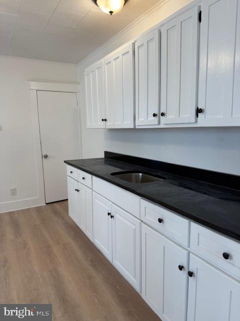 1424 Huddell Avenue Marcus Hook, PA 19061 - Photo 4 of 20 a kitchen with granite countertop white cabinets and sink