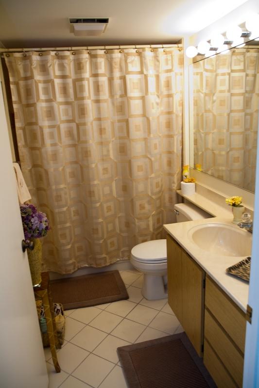 6169 Balboa Circle, Unit 203 Boca Raton, FL 33433 - Photo 16 of 19 a bathroom with a sink toilet and shower