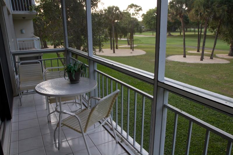 6169 Balboa Circle, Unit 203 Boca Raton, FL 33433 - Photo 3 of 19 a view of a chairs and table in patio with a small yard
