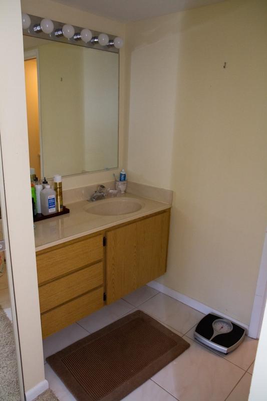 6169 Balboa Circle, Unit 203 Boca Raton, FL 33433 - Photo 9 of 19 a bathroom with a sink and a mirror