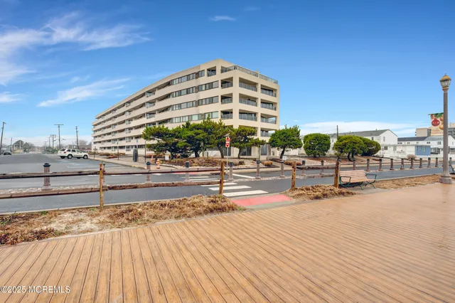 a view of a swimming pool with an outdoor seating