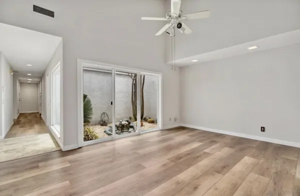 a view of a livingroom with wooden floor