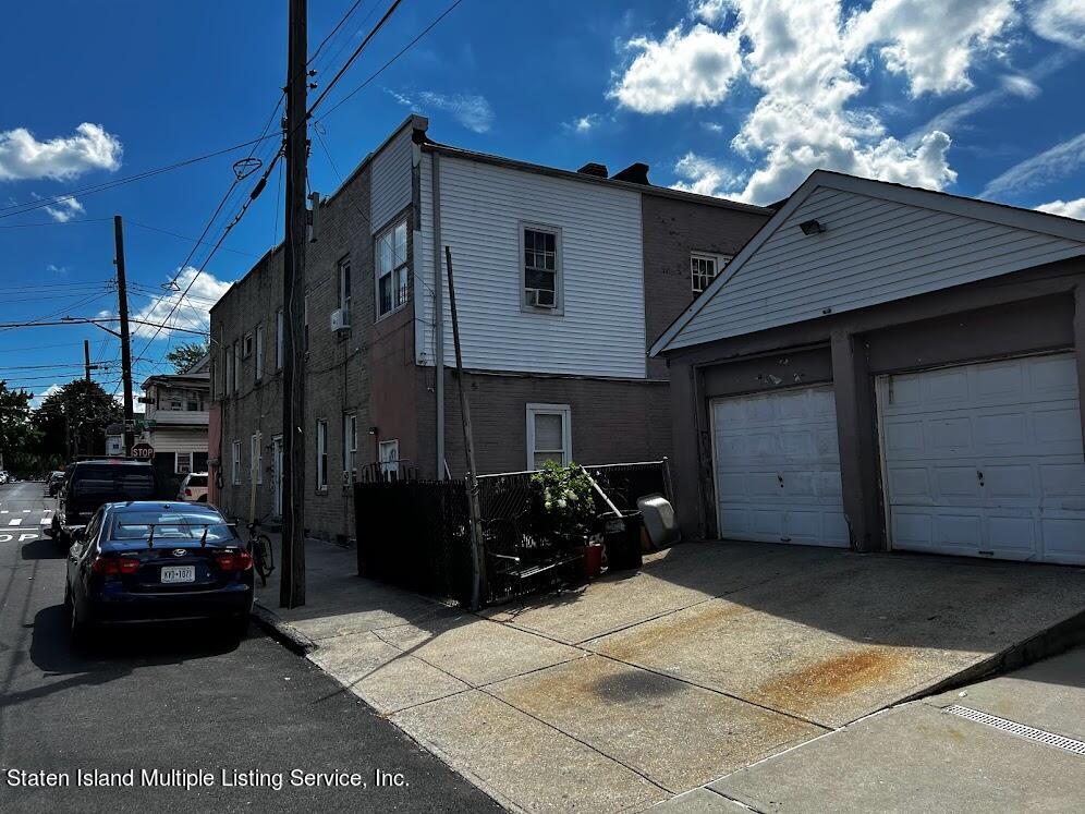 1641 Castleton Avenue Staten Island, NY 10302 - Photo 3 of 15 a car parked in front of a house