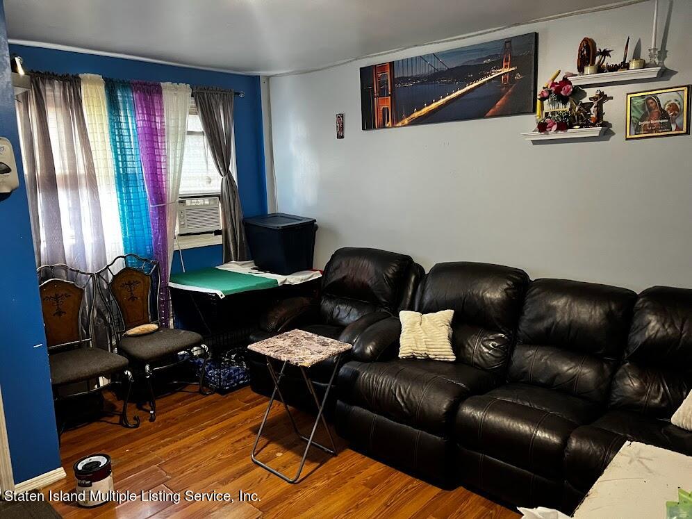 1641 Castleton Avenue Staten Island, NY 10302 - Photo 6 of 15 a living room with furniture and a window