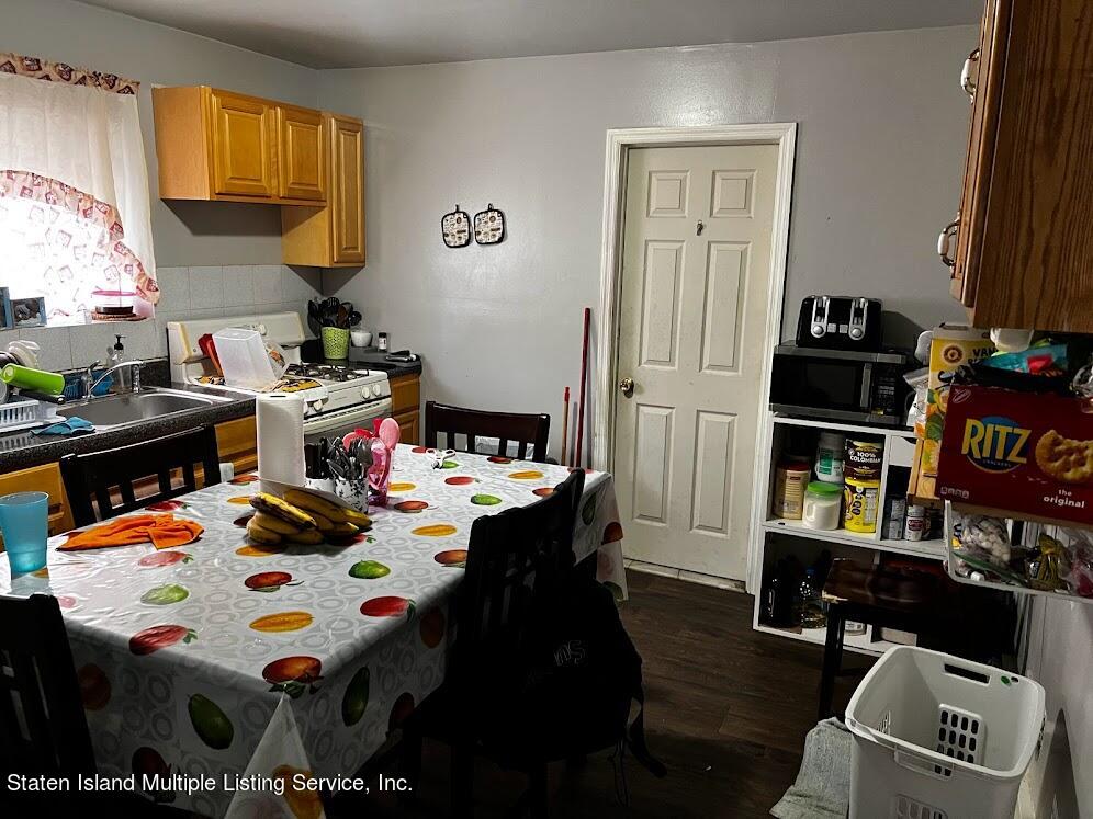 1641 Castleton Avenue Staten Island, NY 10302 - Photo 7 of 15 a kids room that has a bed and a table in it