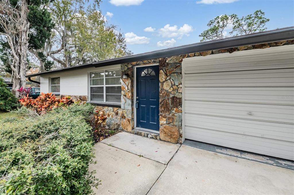 7806 Butler Avenue Hudson, FL 34667 - Photo 2 of 31 a front view of house with yard