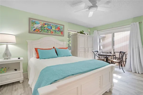 a bedroom with a bed and a table