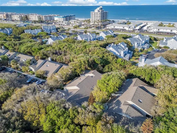 an aerial view of residential houses with outdoor space