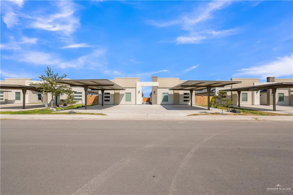a big house with large windows and a big yard