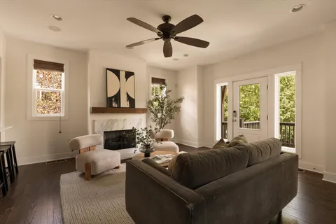 a living room with furniture and a fireplace
