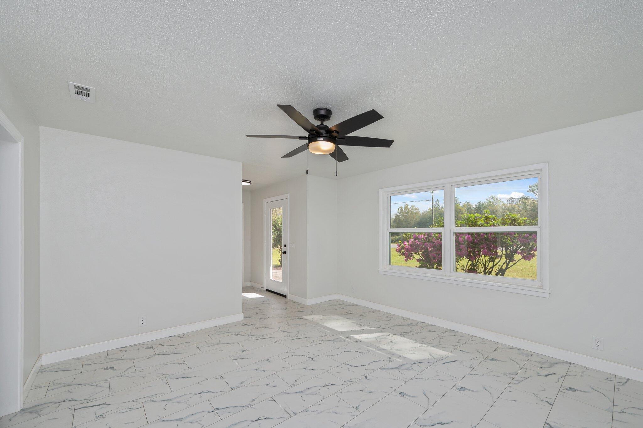22543 Highway 331 Laurel Hill, FL 32567 - Photo 11 of 36 a view of an empty room with a window