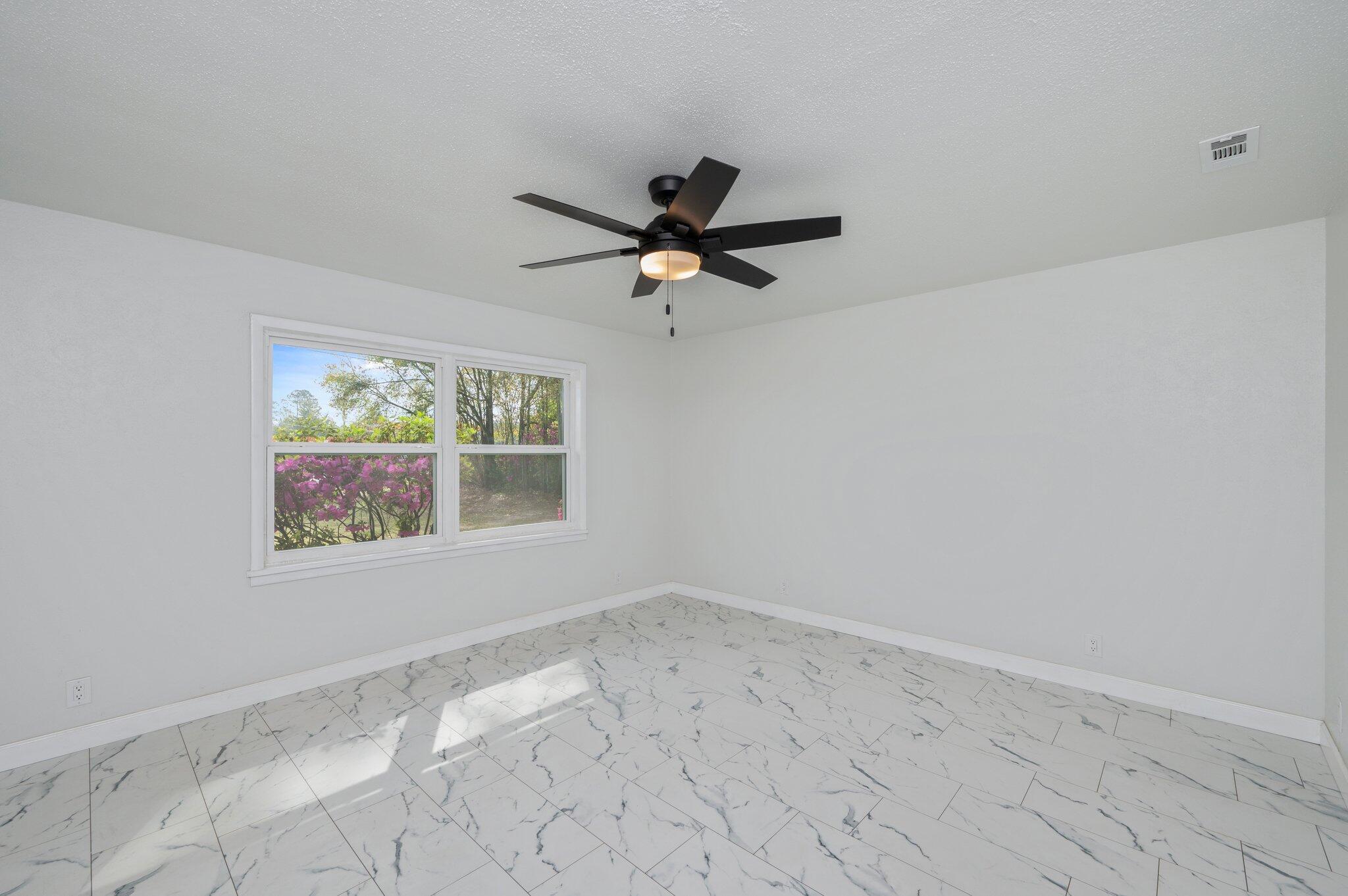 22543 Highway 331 Laurel Hill, FL 32567 - Photo 13 of 36 a view of an empty room with a window