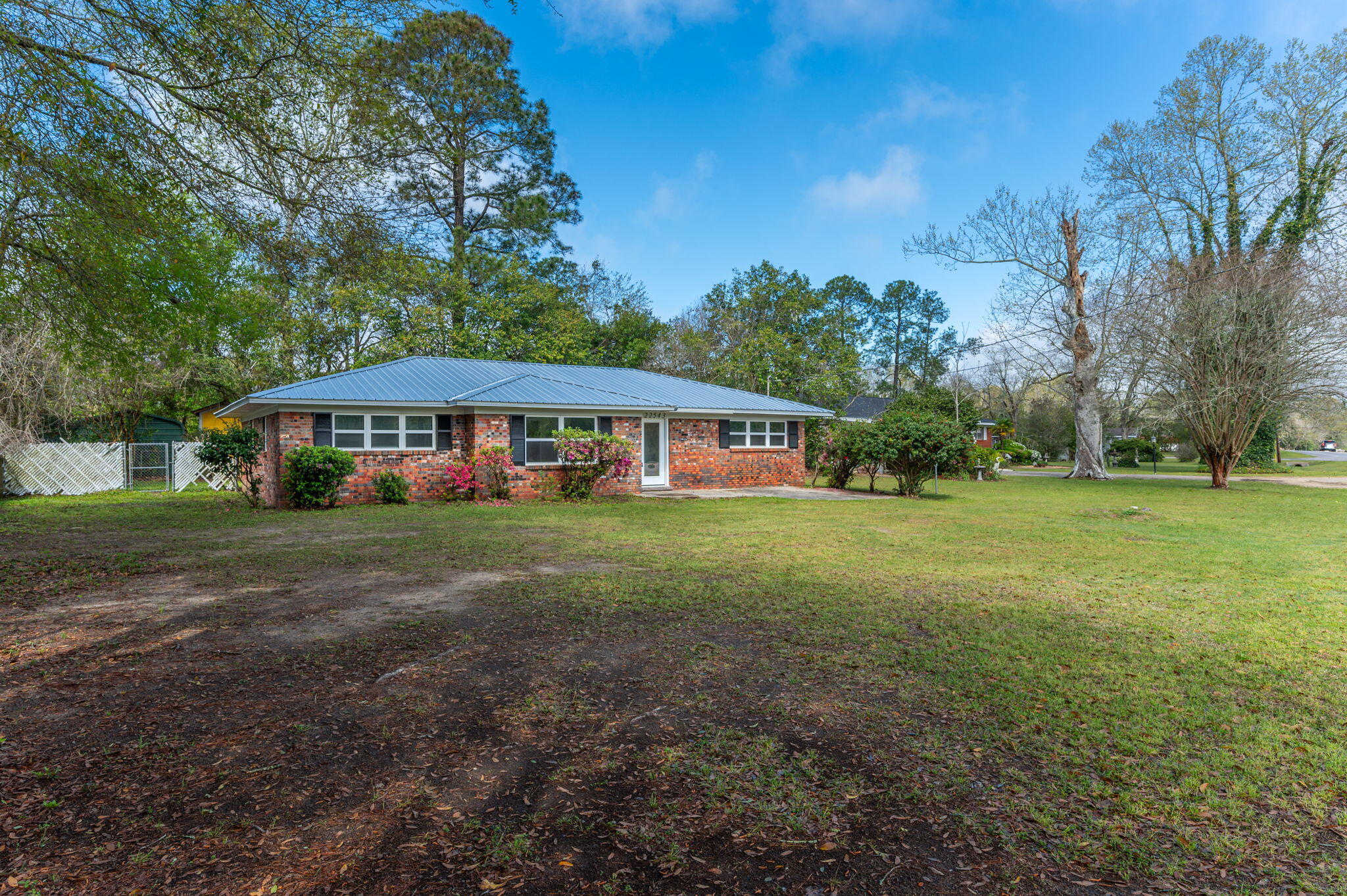 22543 Highway 331 Laurel Hill, FL 32567 - Photo 3 of 36 a view of house with garden