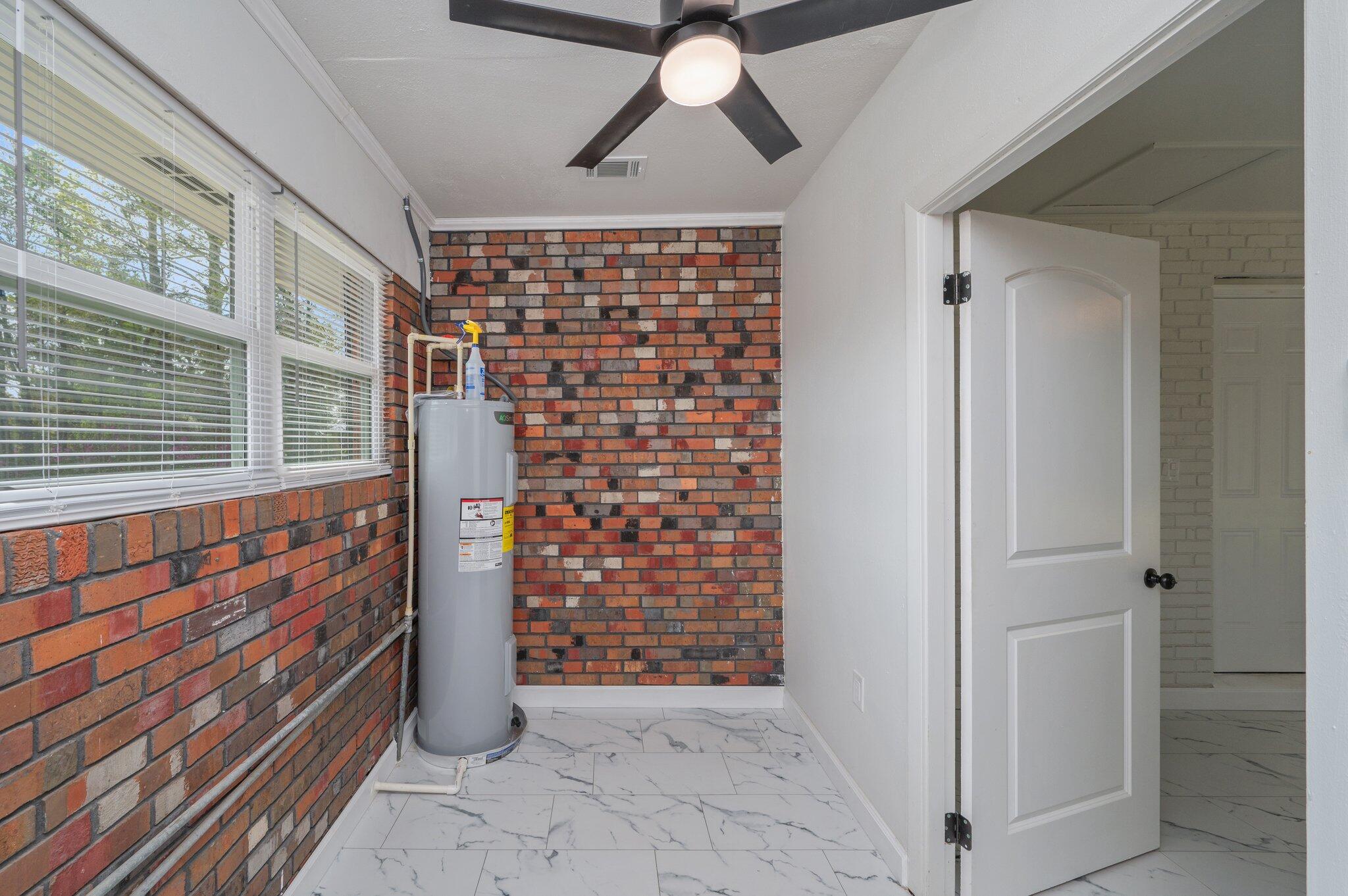 22543 Highway 331 Laurel Hill, FL 32567 - Photo 31 of 36 a view of entryway with a front door and wooden floor