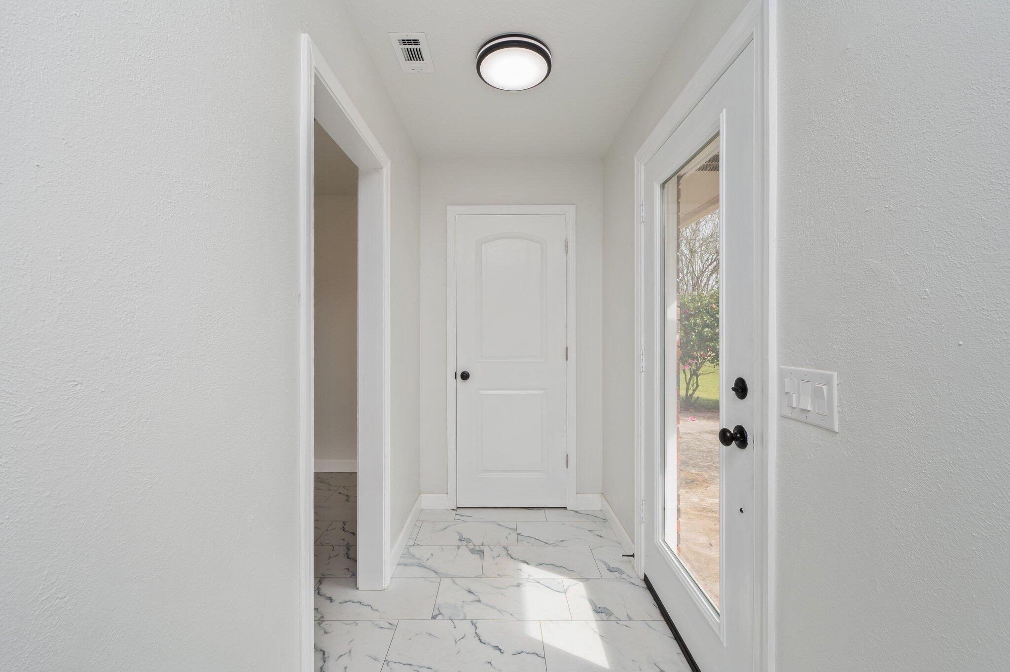 22543 Highway 331 Laurel Hill, FL 32567 - Photo 4 of 36 a view of a hallway with wooden floor