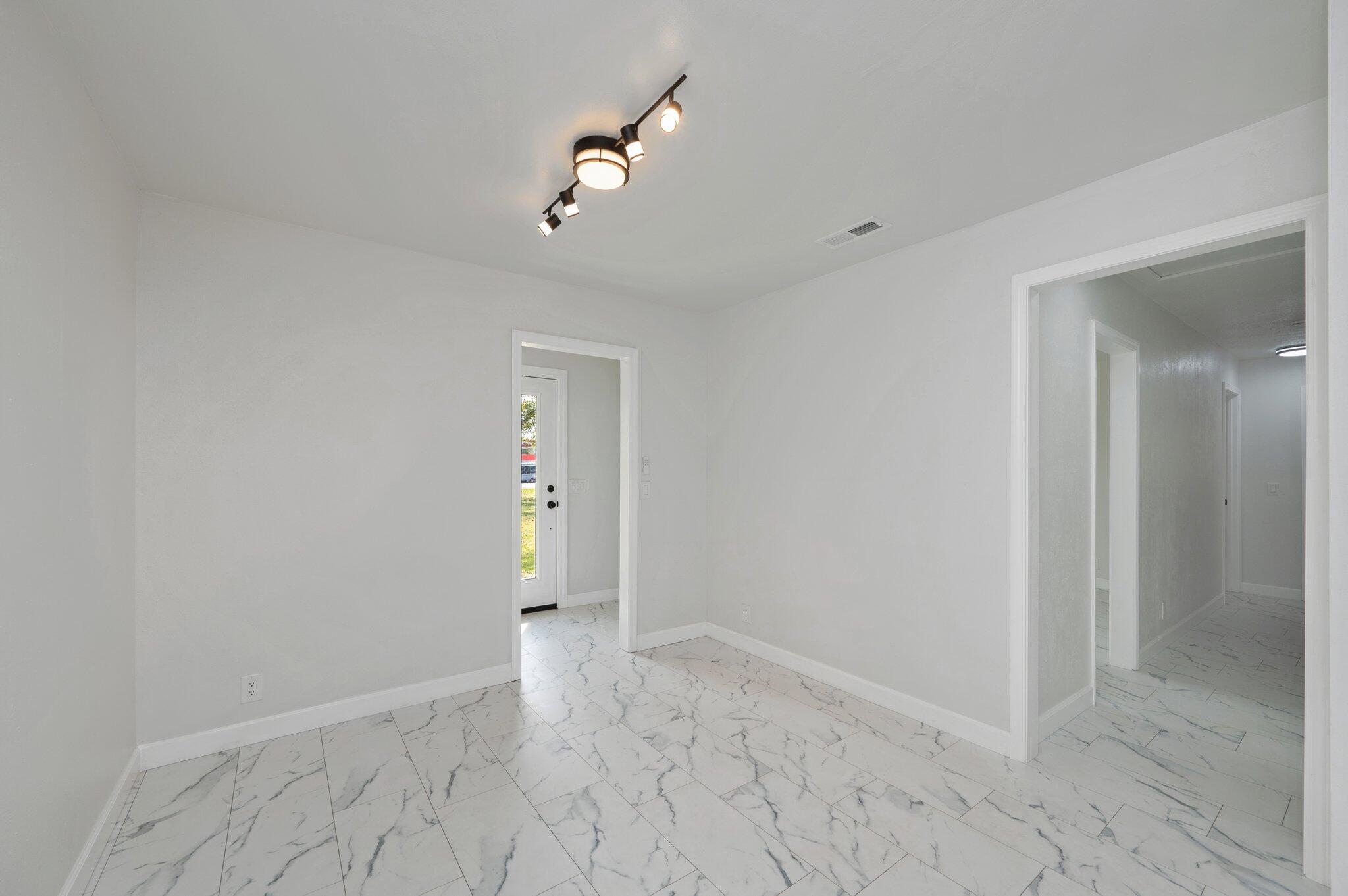 22543 Highway 331 Laurel Hill, FL 32567 - Photo 10 of 36 wooden floor in an empty room