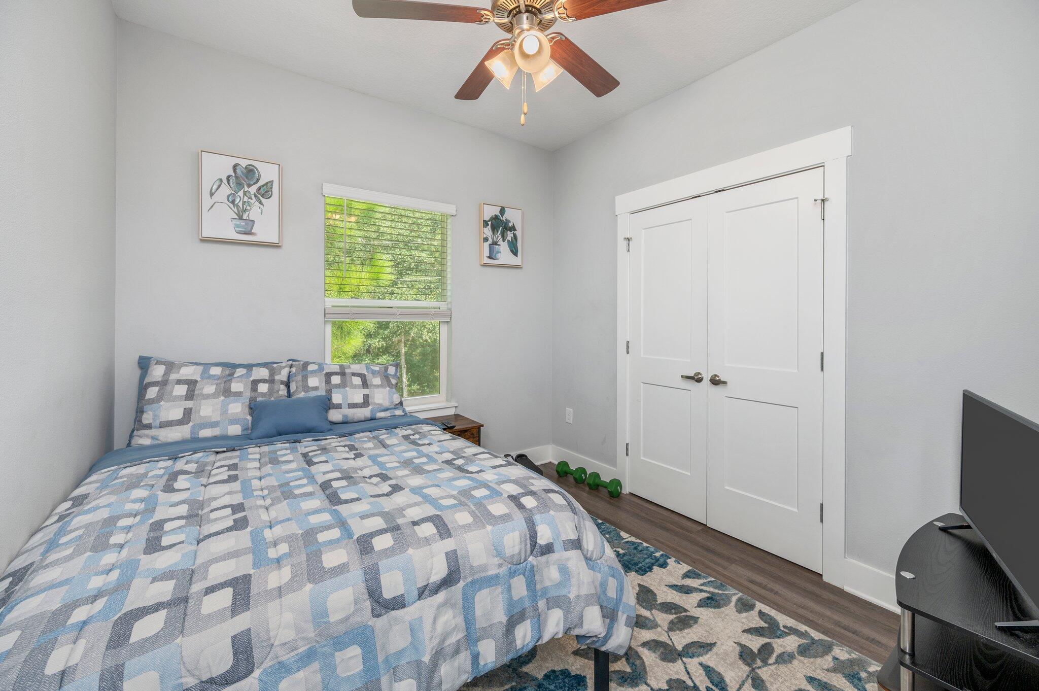 166 North Sand Palm Road Freeport, FL 32439 - Photo 15 of 23 a bedroom with a bed and a window