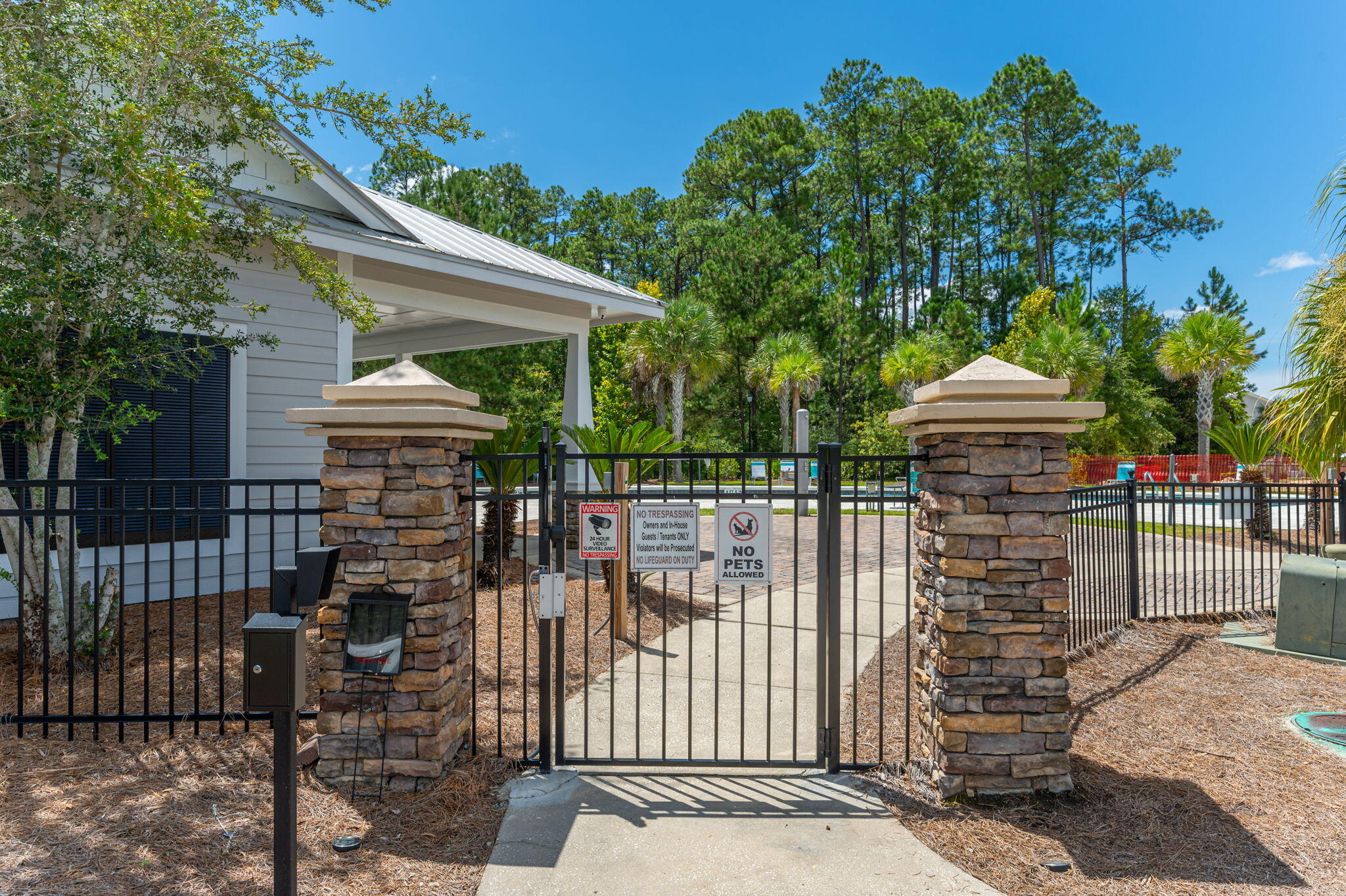 166 North Sand Palm Road Freeport, FL 32439 - Photo 18 of 23 a front view of a house with a garden