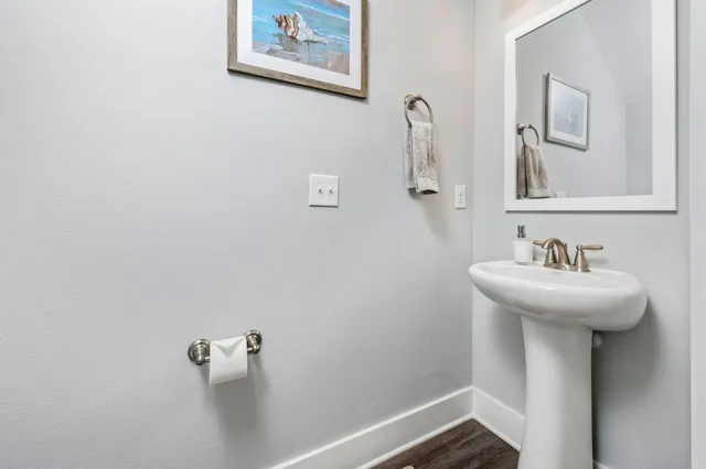 a bathroom with a sink and mirror