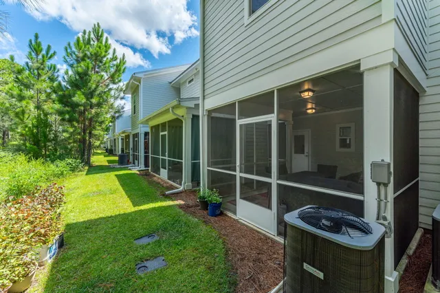 a view of an house with backyard space and garden