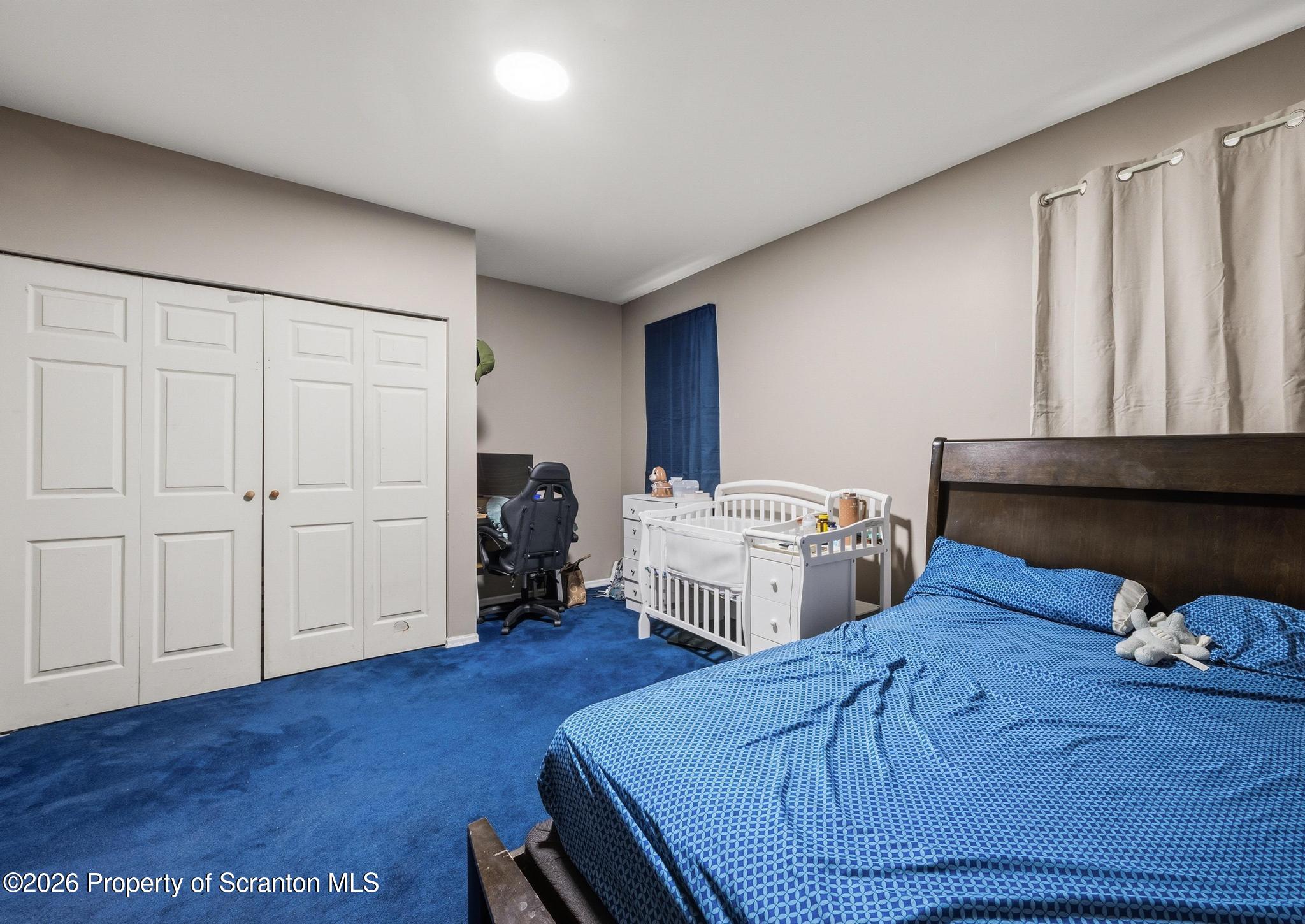518 Prospect Avenue Scranton, PA 18505 - Photo 22 of 59 a bedroom with bed and wooden floor