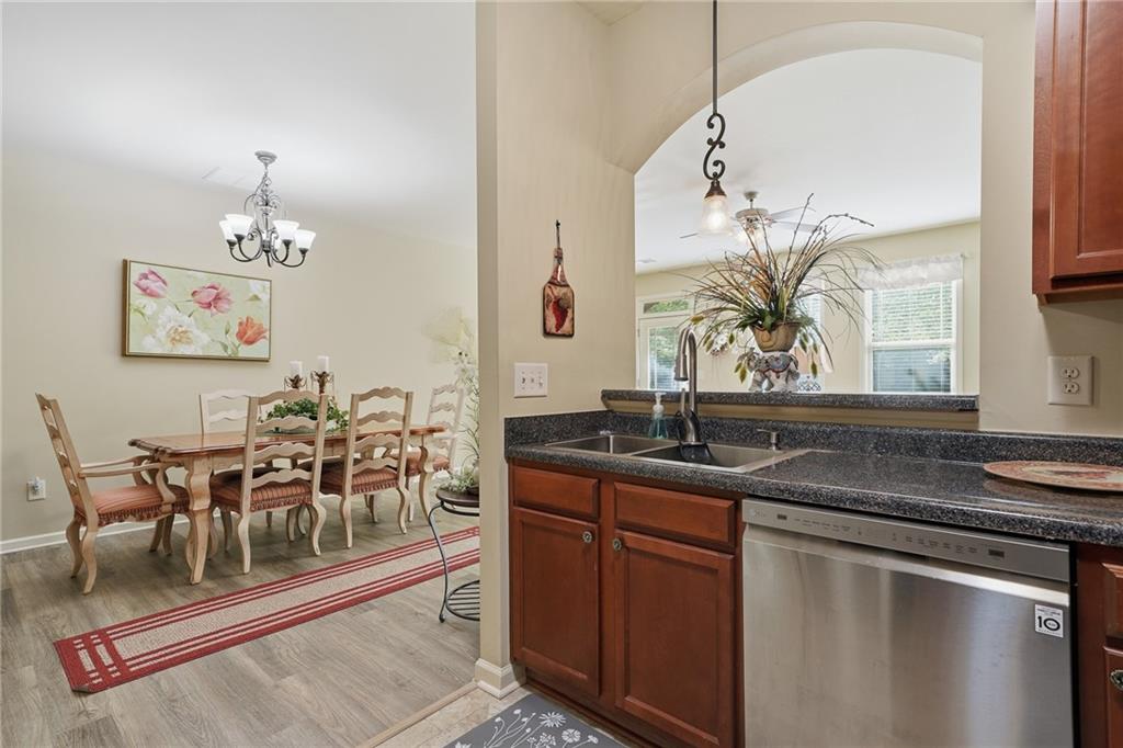608 Myers Gate Road Ball Ground, GA 30107 - Photo 10 of 31 a dining hall with granite countertop a sink and a stove with granite countertops