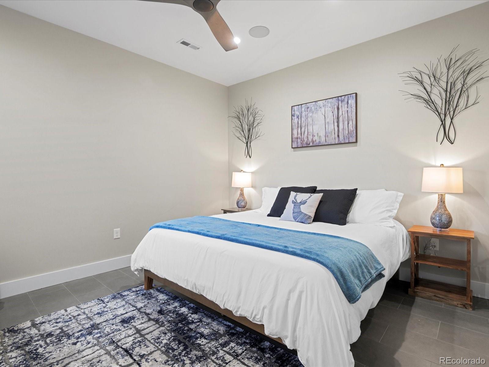 718 Emerson Gulch Road Boulder, CO 80302 - Photo 19 of 42 a bedroom with bed and a night stand