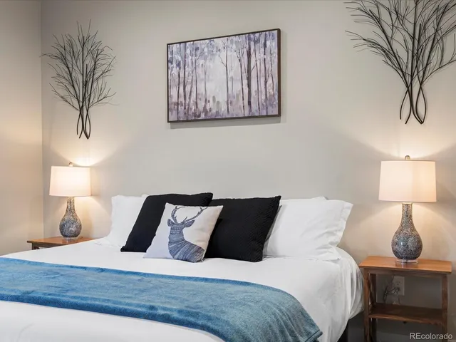 a bedroom with a rug and a rug