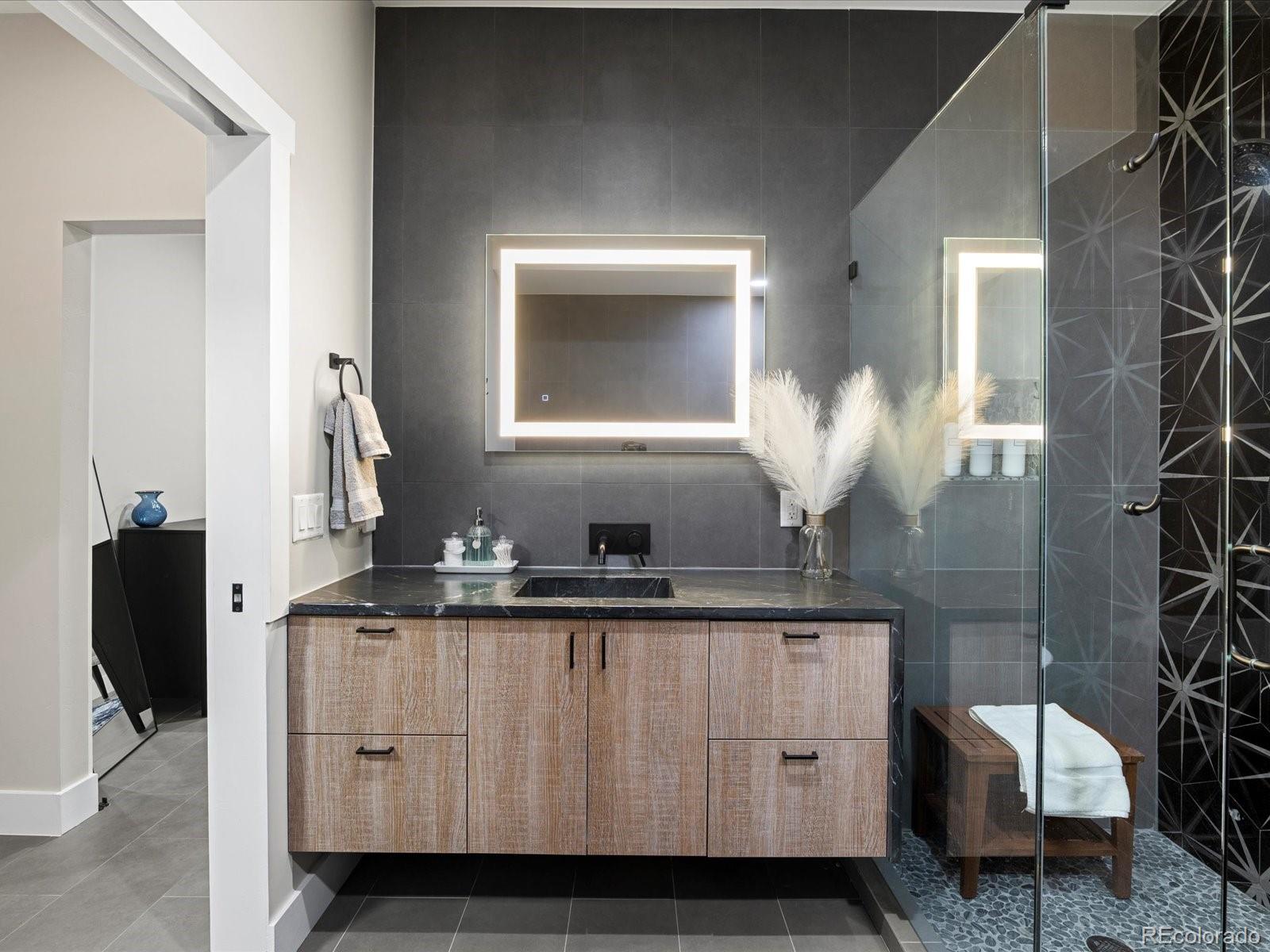 718 Emerson Gulch Road Boulder, CO 80302 - Photo 23 of 42 a bathroom with a sink and a mirror