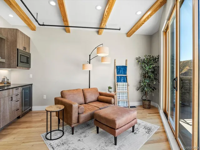 a living room with furniture and a rug