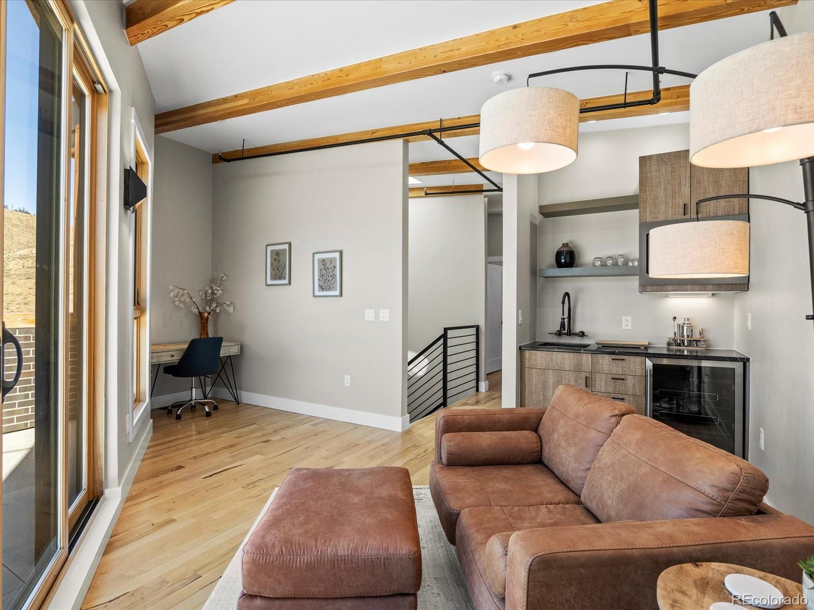 718 Emerson Gulch Road Boulder, CO 80302 - Photo 28 of 42 a living room with furniture and a rug