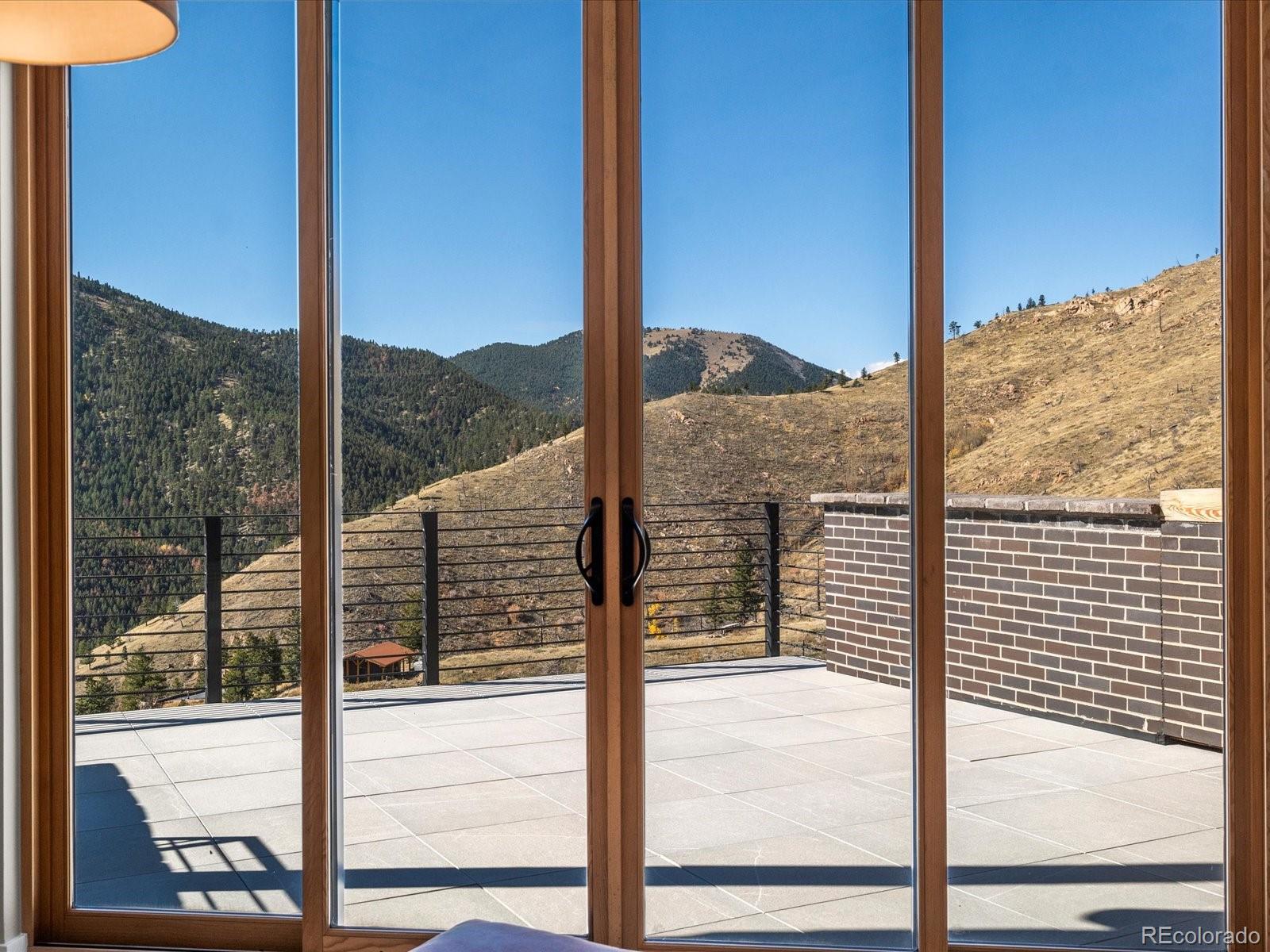 718 Emerson Gulch Road Boulder, CO 80302 - Photo 32 of 42 a view of a balcony from a window