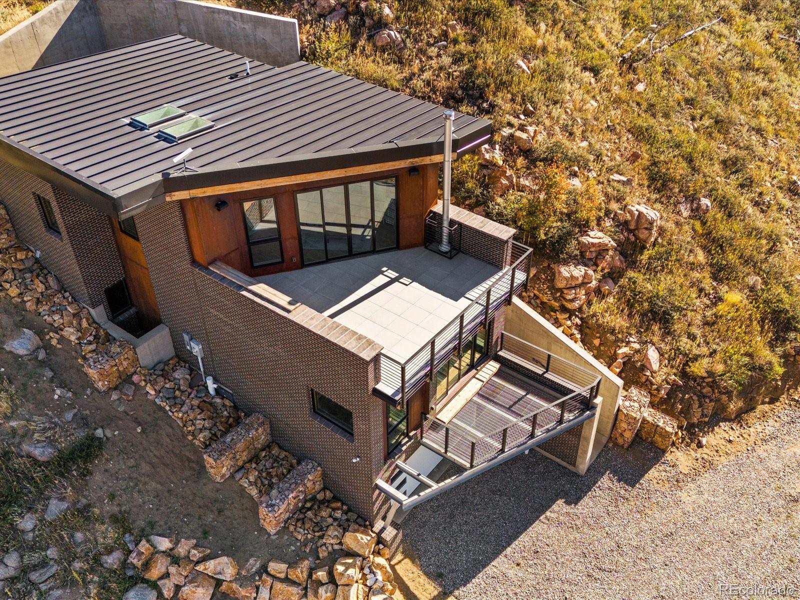 718 Emerson Gulch Road Boulder, CO 80302 - Photo 40 of 42 a roof deck with table and chairs