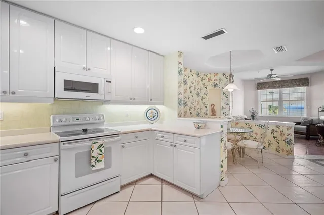 a work room with furniture and windows