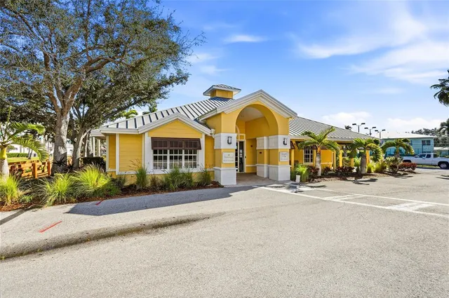a view of a swimming pool with a patio and a yard