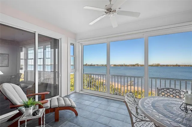 a living room with furniture a rug and a chandelier