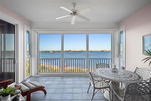 a view of a dining room and chandelier fan