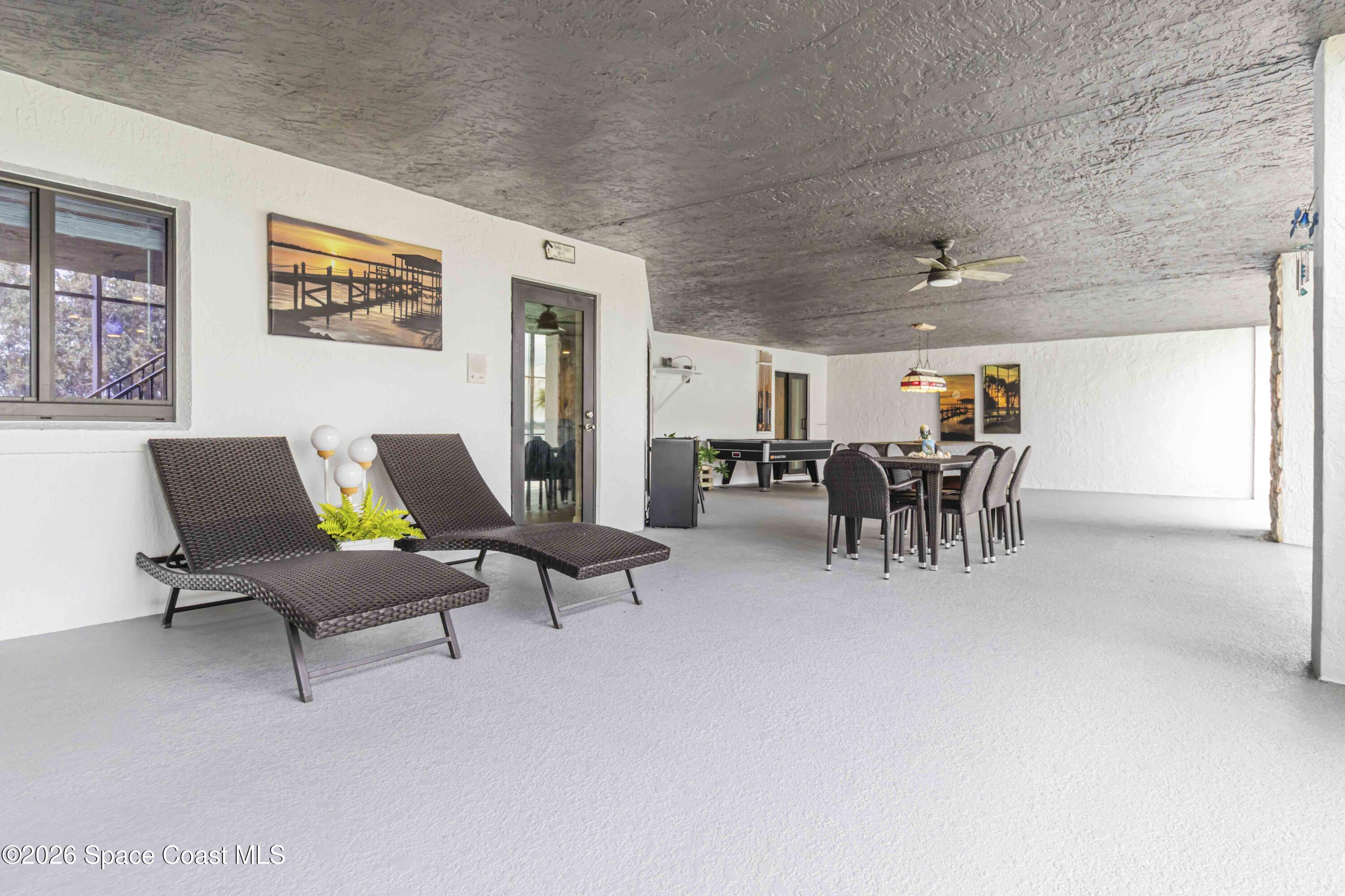 110 Barnacle Place Rockledge, FL 32955 - Photo 47 of 71 a living room with furniture and kitchen area