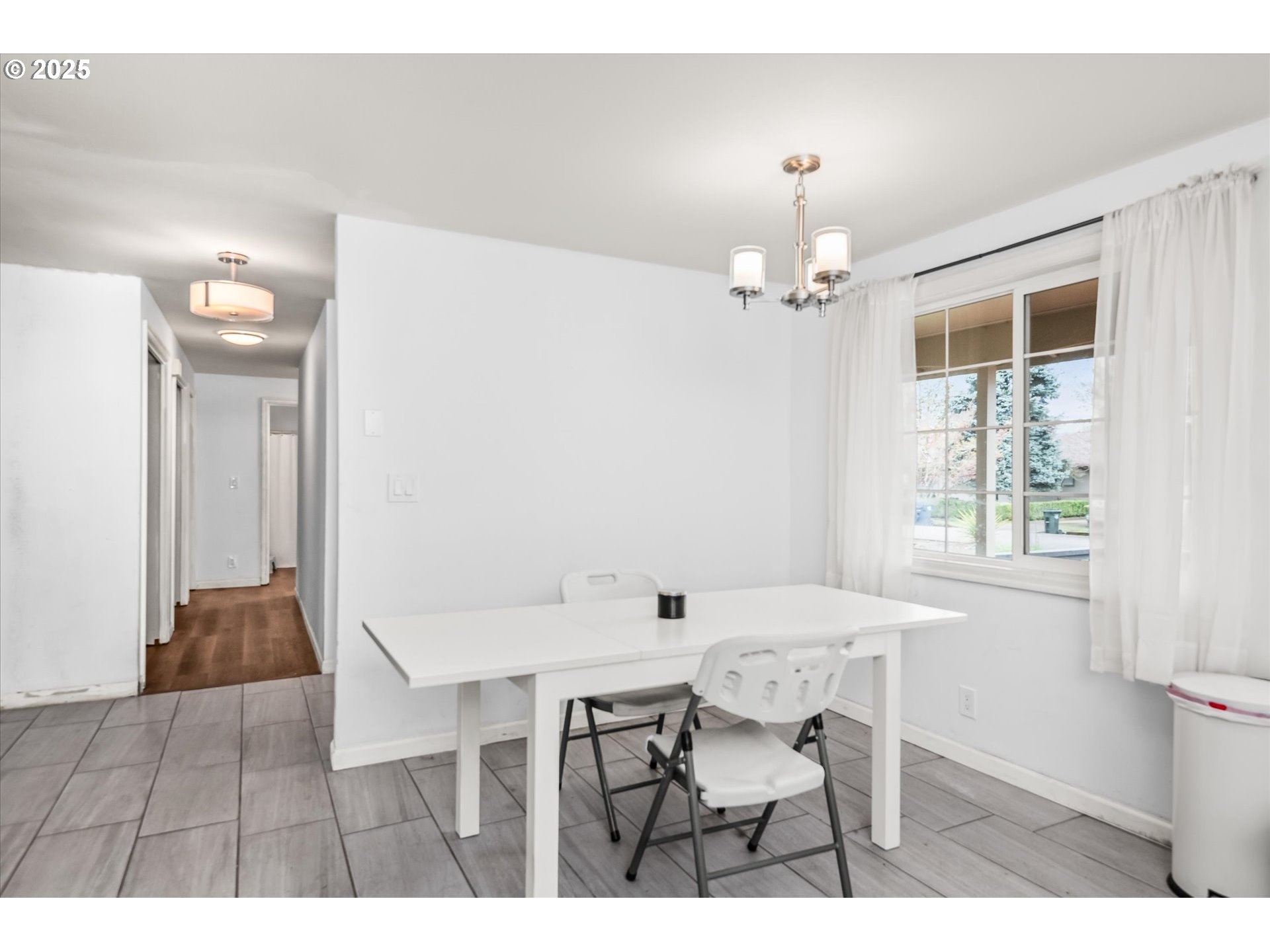 1310 Corum Avenue Eugene, OR 97401 - Photo 13 of 28 a view of a dining room with furniture and chandelier