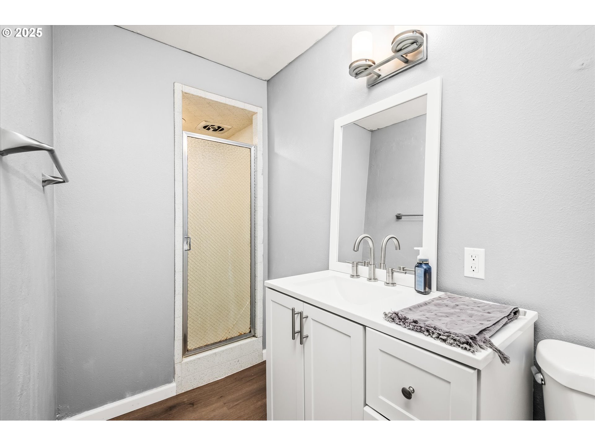 1310 Corum Avenue Eugene, OR 97401 - Photo 19 of 28 a bathroom with a sink vanity and a mirror