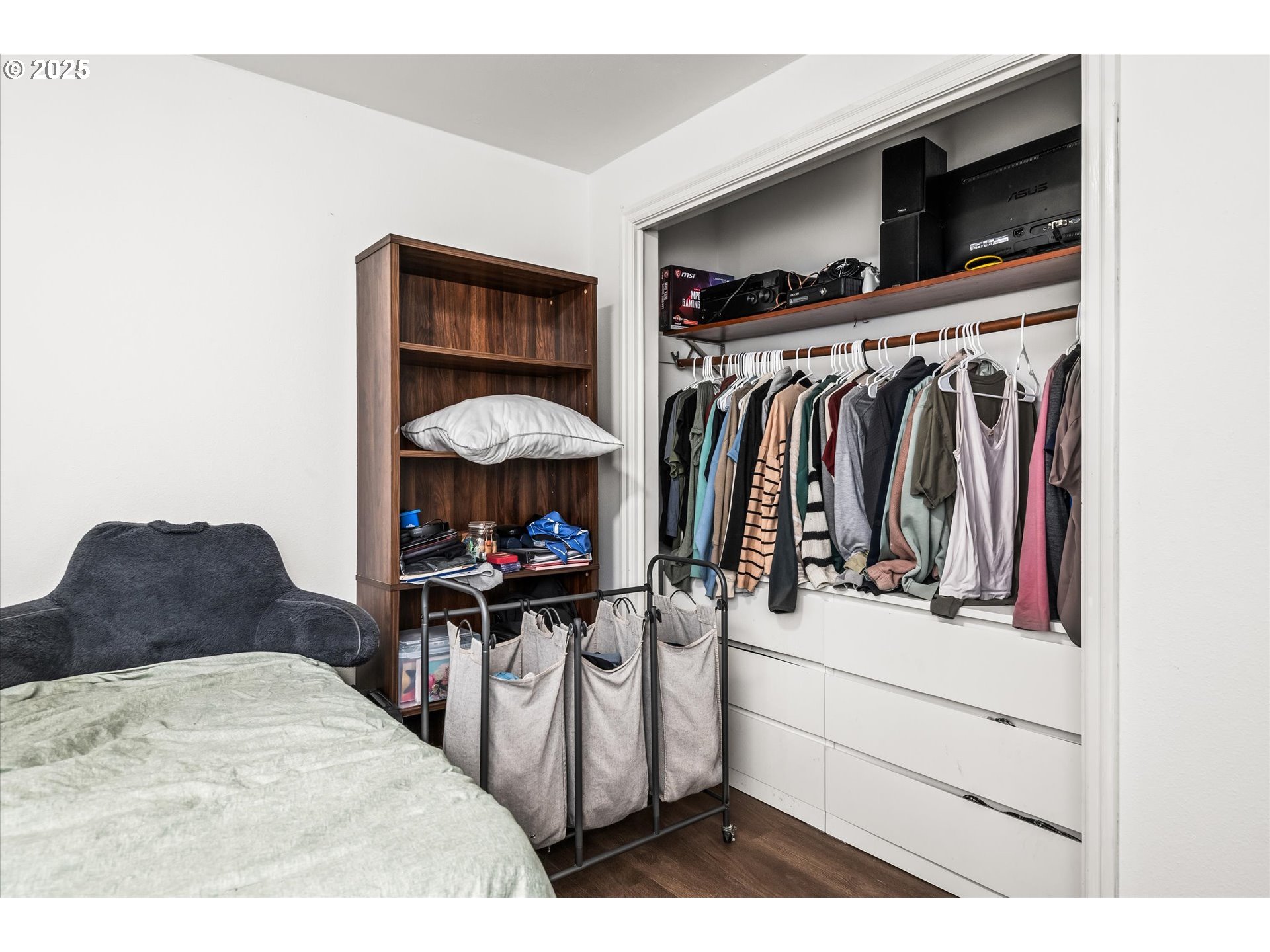 1310 Corum Avenue Eugene, OR 97401 - Photo 21 of 28 a view of walk in closet with clothes and shoes