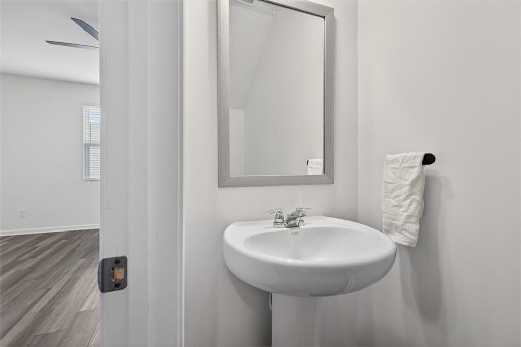 64 Thetford Way Winder, GA 30680 - Photo 13 of 41 a bathroom with a sink and a mirror