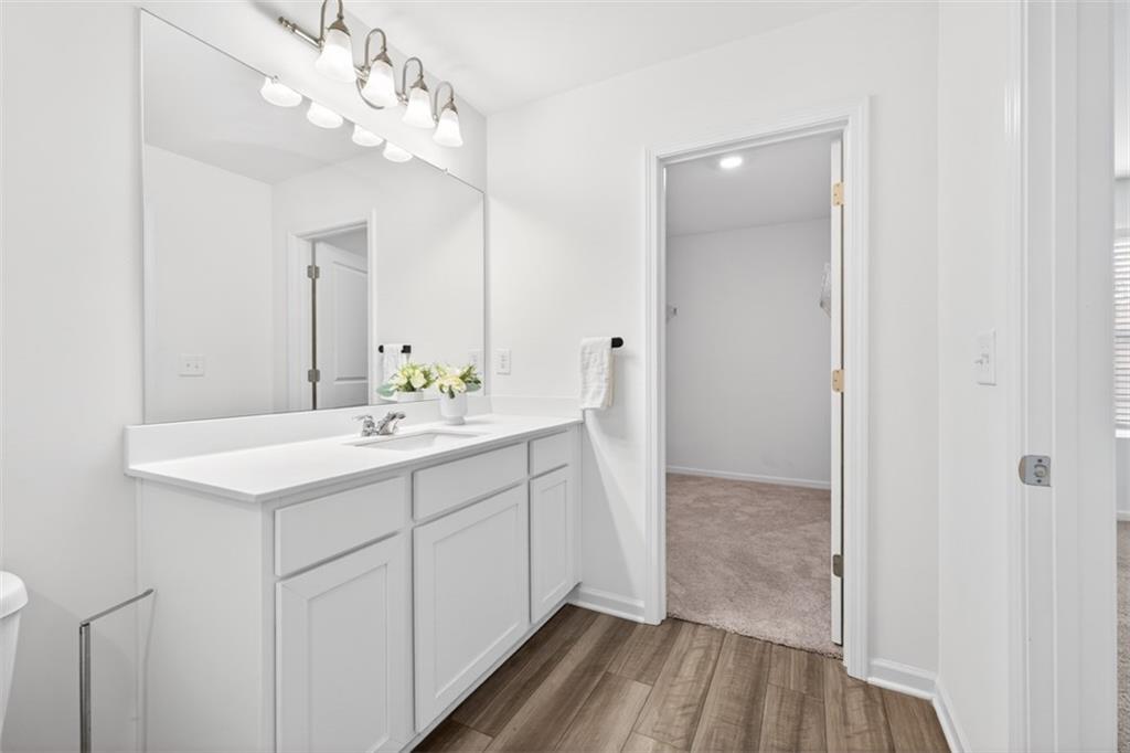 64 Thetford Way Winder, GA 30680 - Photo 20 of 41 a bathroom with a sink double vanity and a mirror