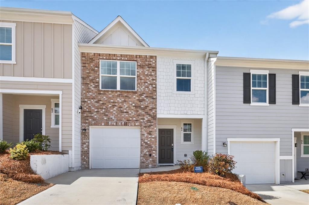 64 Thetford Way Winder, GA 30680 - Photo 2 of 41 a front view of a house with yard