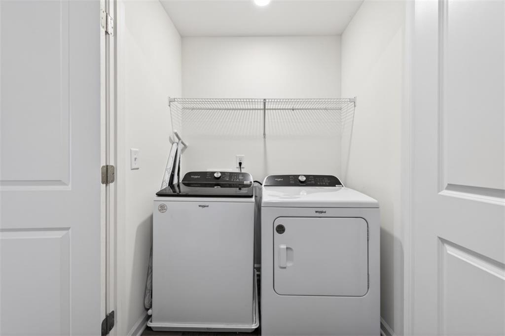 64 Thetford Way Winder, GA 30680 - Photo 29 of 41 a view of storage and utility room with washer and dryer
