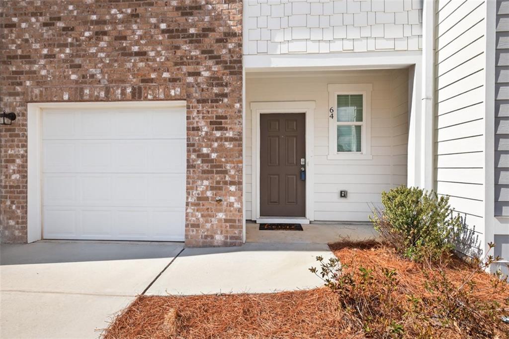 64 Thetford Way Winder, GA 30680 - Photo 3 of 41 a front view of a house with a garage
