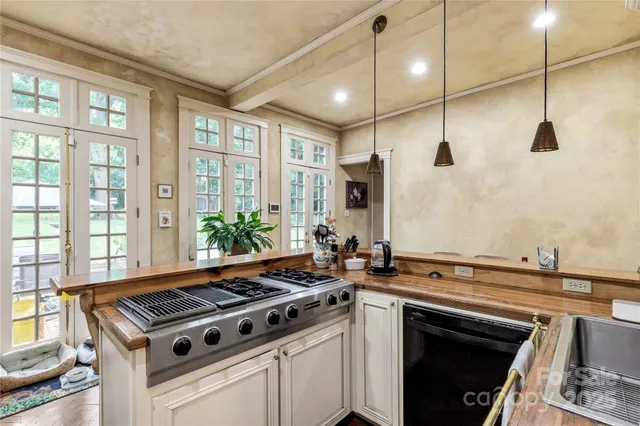 a kitchen with a stove and a sink
