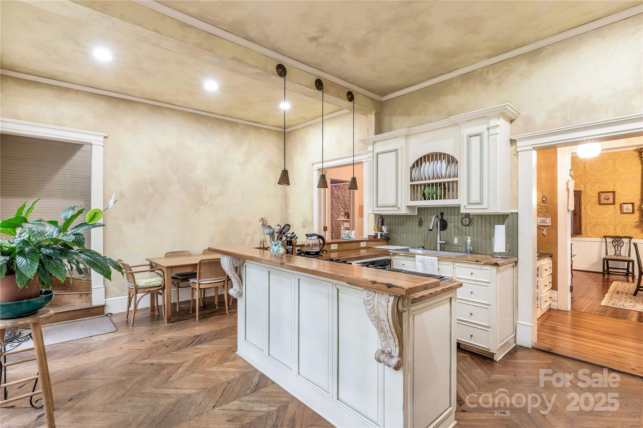7 Kings Mountain Street York, SC 29745 - Photo 19 of 46 a kitchen with cabinets and chairs in it
