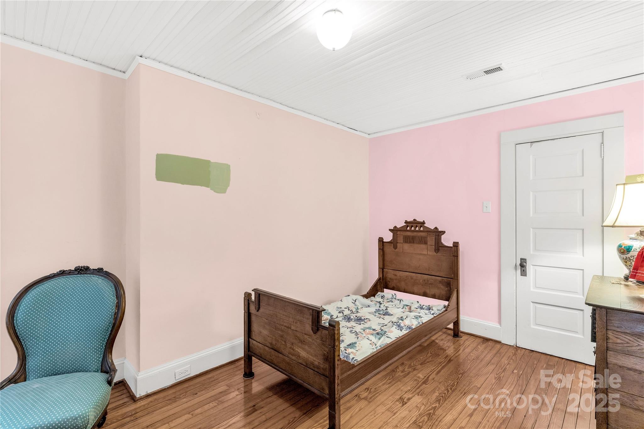 7 Kings Mountain Street York, SC 29745 - Photo 32 of 46 a bedroom with a bed and a chair